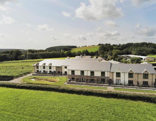 an aerial view of a large building in a field at Llanerch Vineyard Hotel in Hensol