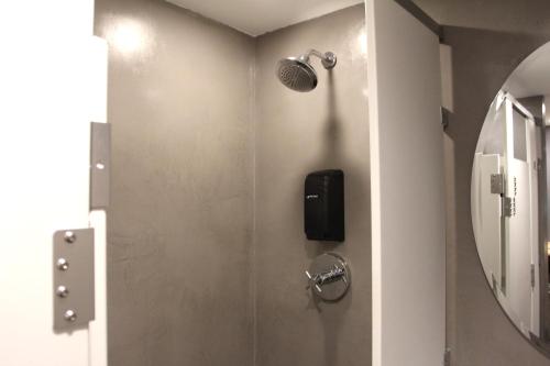 a bathroom with a phone on the wall at Hotel Gaythering - Gay Hotel - All Adults Welcome in Miami Beach