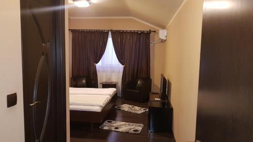 Postel nebo postele na pokoji v ubytování Vila Crinul