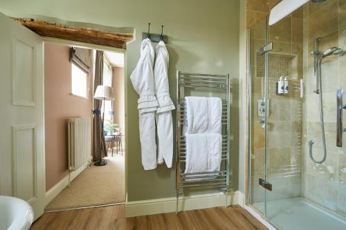 a bathroom with a shower and a toilet and a shower at The Methuen Arms in Corsham