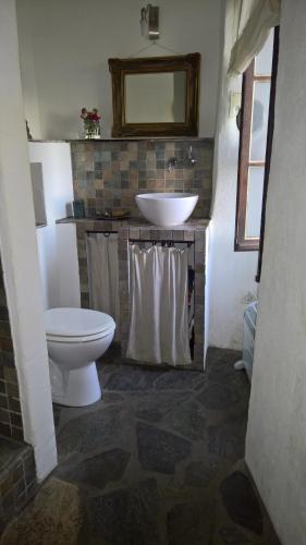 a bathroom with a white sink and a toilet at Sole e Ventu 90qm in San-Giovanni-di-Moriani