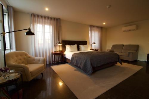 Katil atau katil-katil dalam bilik di Paço do Bispo Boutique House
