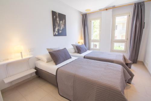 Postel nebo postele na pokoji v ubytování Precioso Apartamento con wifi y A/C