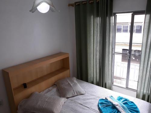 Ένα ή περισσότερα κρεβάτια σε δωμάτιο στο HOTEL PINOTTI LTDA