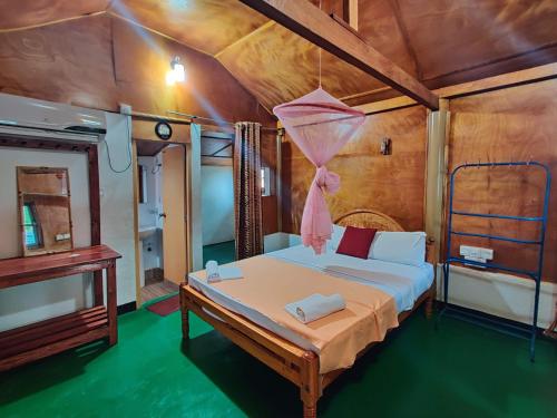 Postel nebo postele na pokoji v ubytování Sunntop Cabana