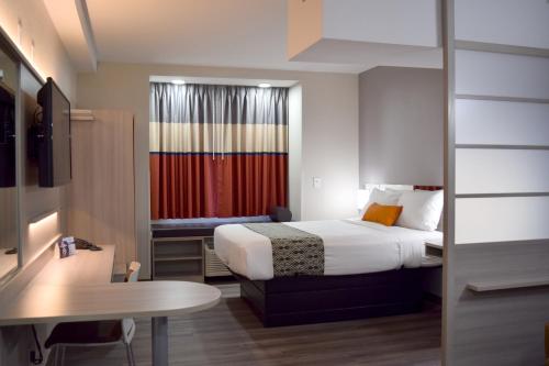 Postel nebo postele na pokoji v ubytování Microtel Inn & Suites by Wyndham Raleigh