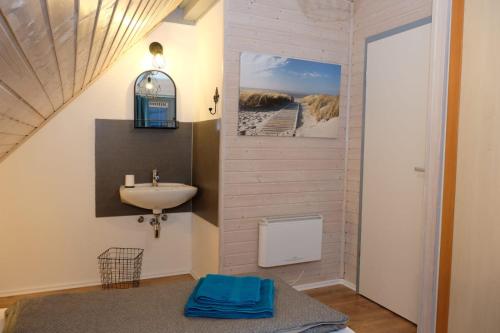 a bathroom with a sink and a sink at Ferienhaus Steffi in Kirchheim