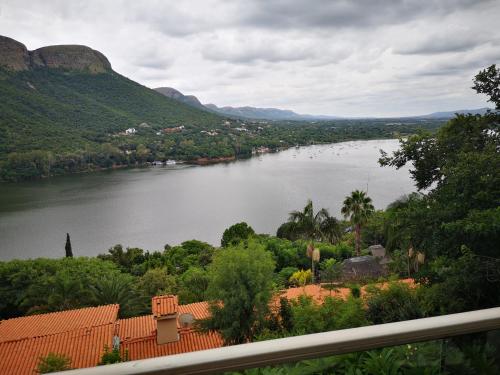 a view of a river with mountains in the background at Letamong in Hartbeespoort