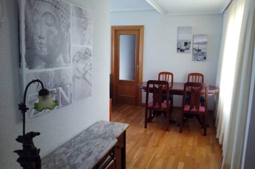 a dining room with a table and two chairs at APARTAMENTO CONGRESO in Logroño