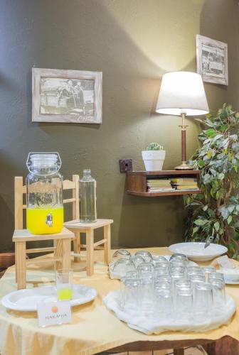 a table with a bunch of glass jars on it at Zumaia Hotela in Zumaia