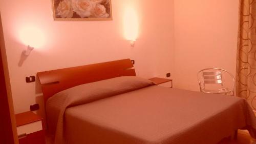 Cama ou camas em um quarto em Sicily Guest House