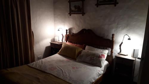 En eller flere senge i et værelse på Casa quinta Los Alazanes