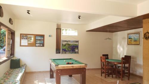 a living room with a pool table in it at Pousada Dois Irmãos in Trindade