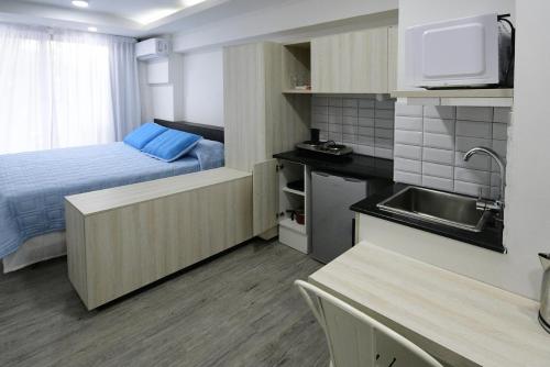 Kuchyň nebo kuchyňský kout v ubytování Quijano Hotel - Aparts & Suites