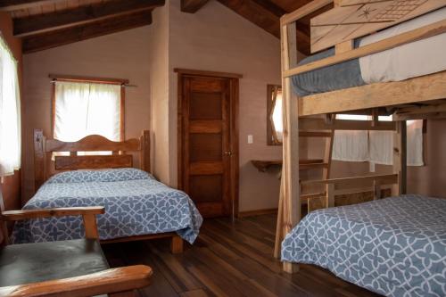 Postel nebo postele na pokoji v ubytování Cabaña Ensueño
