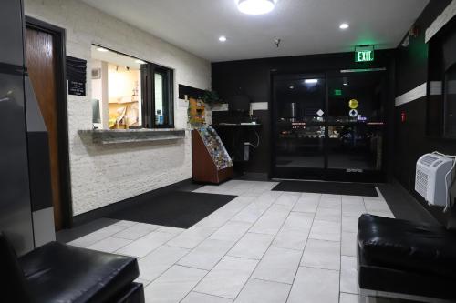 a lobby of a store with a door and a store at Super 8 by Wyndham Richmond Airport VA in Richmond