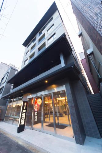 a store front of a building on a street at Hotel IL Verde Kyoto in Kyoto