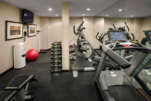 a gym with treadmills and elliptical machines at Holiday Inn Manhattan 6th Ave - Chelsea by IHG in New York