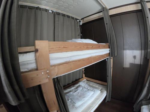 a couple of bunk beds in a room at Kumano Backpackers in Tanabe