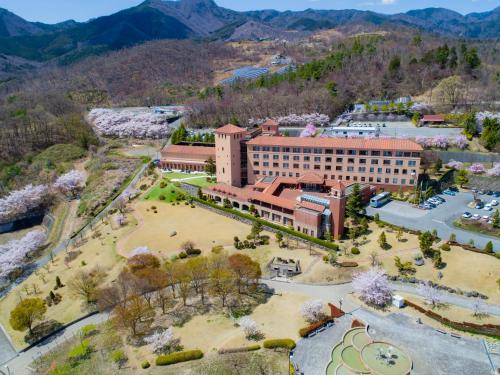 an aerial view of a building with a park at Fruit Park Fujiya Hotel in Yamanashi