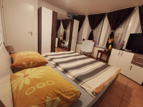 Кровать или кровати в номере Apartments Violeta