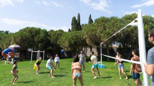 a group of people playing soccer in a field at Grand Hotel Ontur Cesme in Cesme