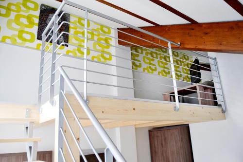 a room with a balcony in a house at B&B Seventy Design in Dimaro