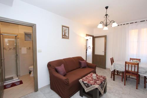 a living room with a couch and a table at Apartment Zara in Rovinj