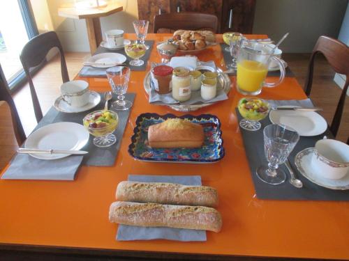 an orange table with food on top of it at La Galerie in Toulouse