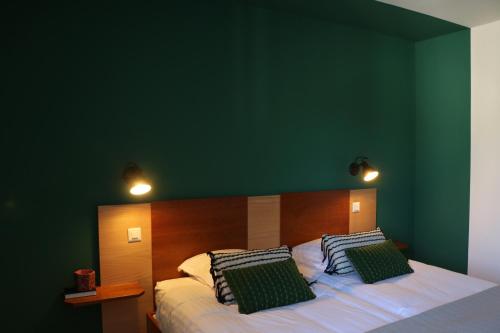 Ένα ή περισσότερα κρεβάτια σε δωμάτιο στο Auberge Au Lion d'Or