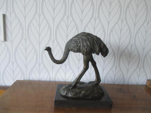 a bronze statue of a bird on a table at La Galerie in Toulouse
