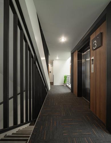 a hallway of an office building with the number on the wall at Nap in Chiangmai in Chiang Mai