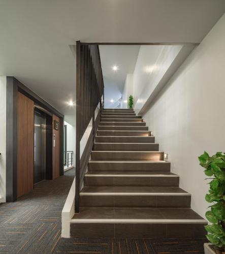 a staircase in a building with a stair case at Nap in Chiangmai in Chiang Mai