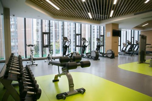 a gym with several treadmills and exercise bikes at Holiday Inn Chengdu Airport by IHG - Free Shuttle to Shuangliu International Airport in Chengdu