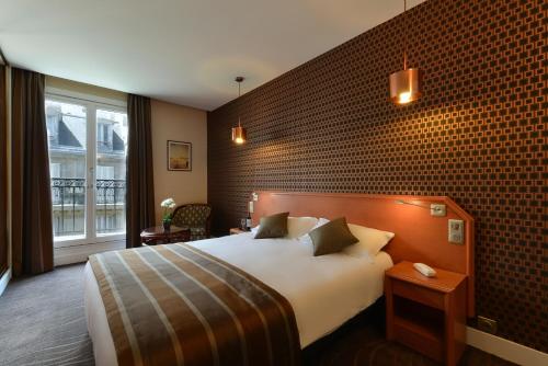 Кровать или кровати в номере Relais du Pré