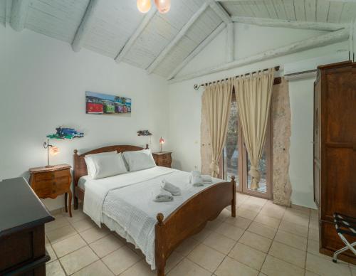 Postel nebo postele na pokoji v ubytování Villa Amit