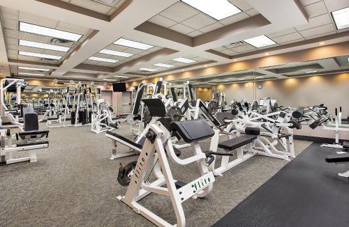 a gym with a lot of treadmills and machines at Crowne Plaza Knoxville Downtown University by IHG in Knoxville