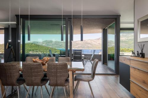 a dining room with a table and chairs at Korcula Hill in Korčula
