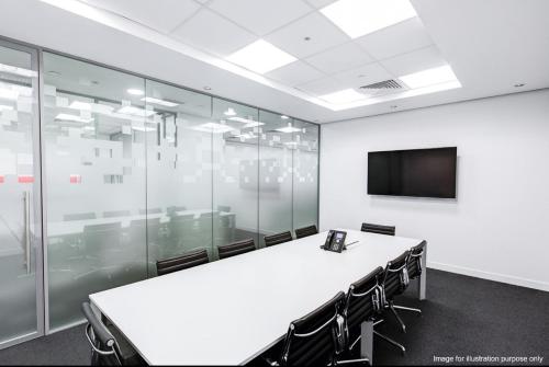 a conference room with a long table and a tv at Americas Best Value Inn Denver in Denver