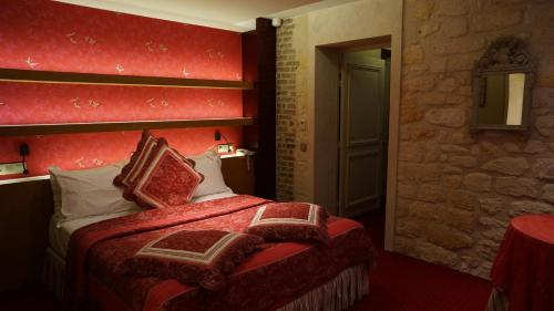 Letto o letti in una camera di Le Relais Médicis