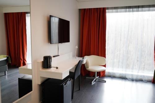 TV a/nebo společenská místnost v ubytování Forenom Aparthotel Gothenburg Nolvik