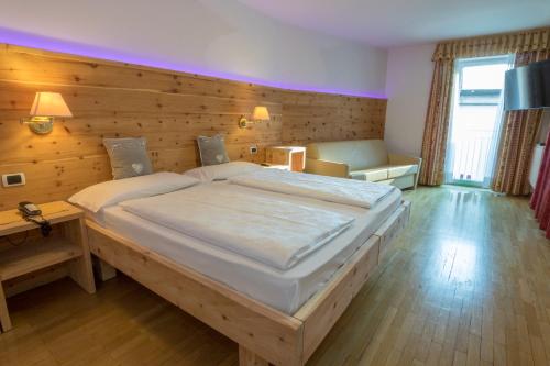 Postel nebo postele na pokoji v ubytování Hotel Garni Snaltnerhof
