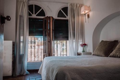 מיטה או מיטות בחדר ב-LA COVACHA DEL PINTOR