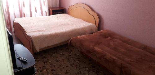 Posteľ alebo postele v izbe v ubytovaní Apartment on Mira 94