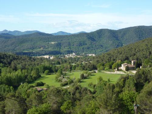 a view of a valley with mountains in the background at Can Mahola in Beuda