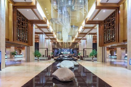 a lobby of a hotel with a chandelier at Crowne Plaza Huangshan Yucheng by IHG in Huangshan
