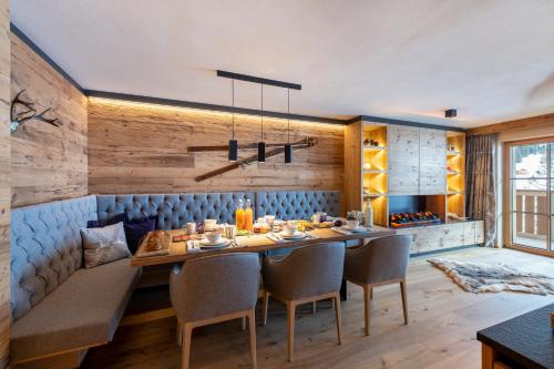a dining room with a table and chairs at Brunnenhof Luxury Apartments in Lech am Arlberg