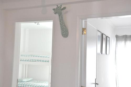 a room with a giraffe head on the wall at Cascais Family & Friends in Cascais