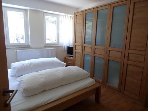 a bedroom with two white pillows on a bed at Linden 1 in Monschau