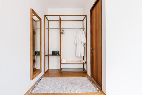 a room with a closet with a door and a rug at APT476 in Bangkok